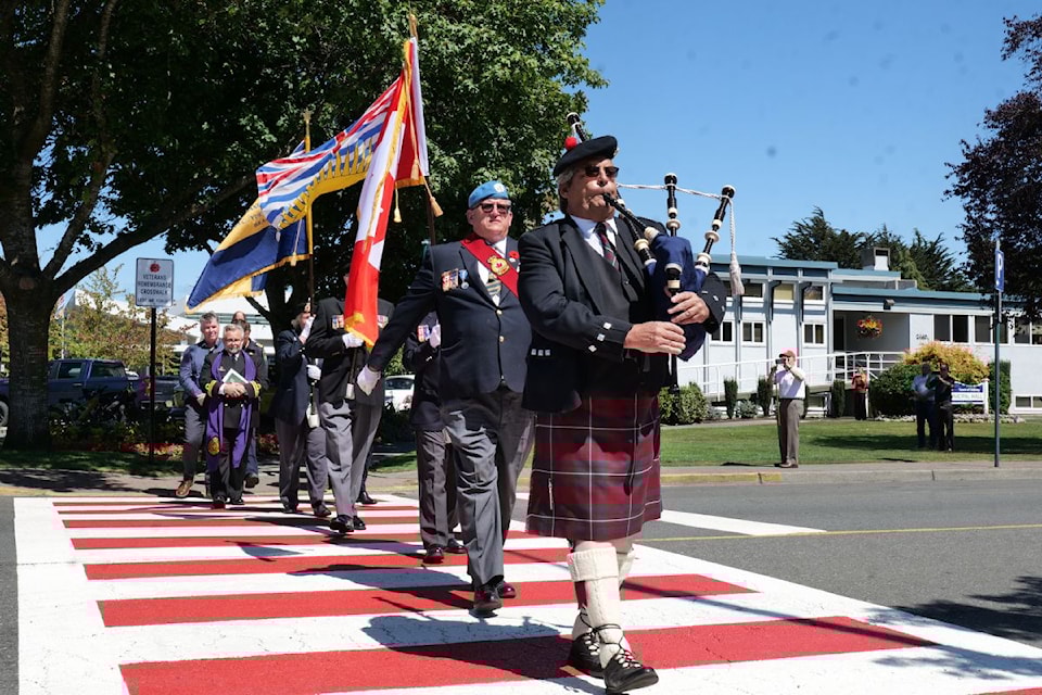 Members of Legion Branch 37 proudly march across the new veteran's crosswalk near the Town of Sidney Municipal Hall.