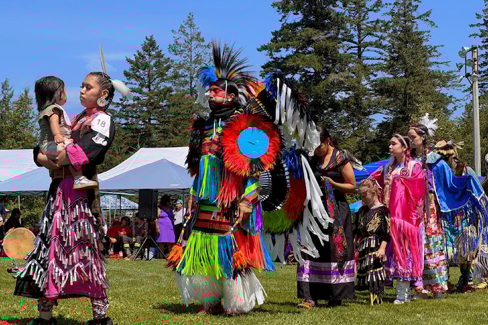 Intertribal grand entry procession members in their colourful regalia.