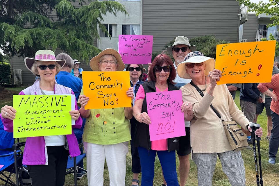 A group of concerned citizens is protesting the proposed 7840 Lochside Drive rental building development.