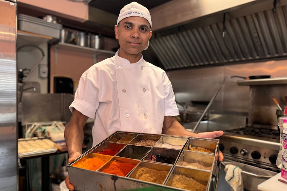 Biju's Indian Cuisine owner Brijesh Poddar is proud of his collection of aromatic spices.