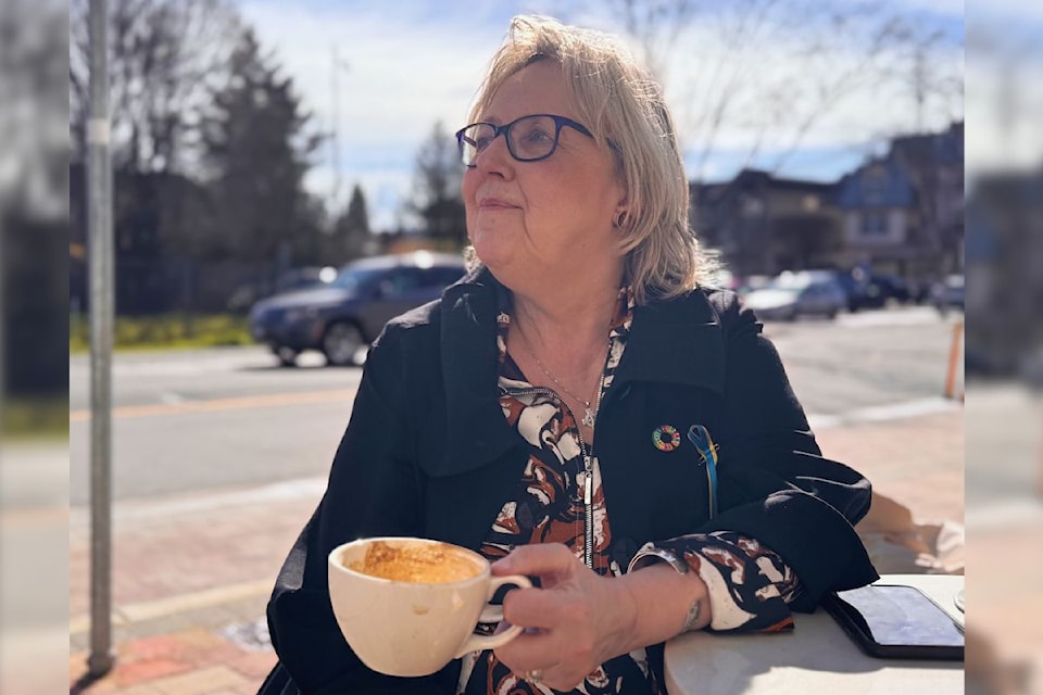 Incumbent Green Party MP Elizabeth May taking a quick coffee break in Sidney.