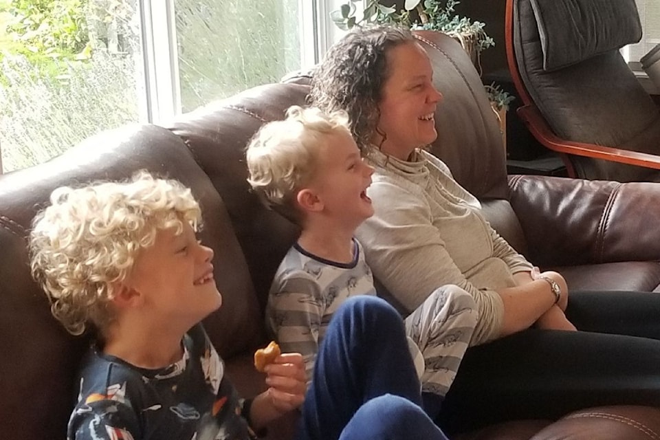 Andrea and her boys hanging out at home.