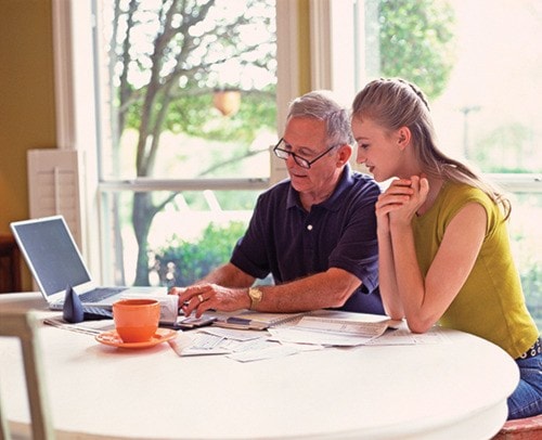 Father and daughter going over finances