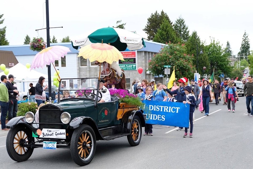 The Butchart Gardens float in the annual Brentwood Bay Festival parade followed by the Woodwyn District Girl Guides. (Alisa Howlett/News staff)
