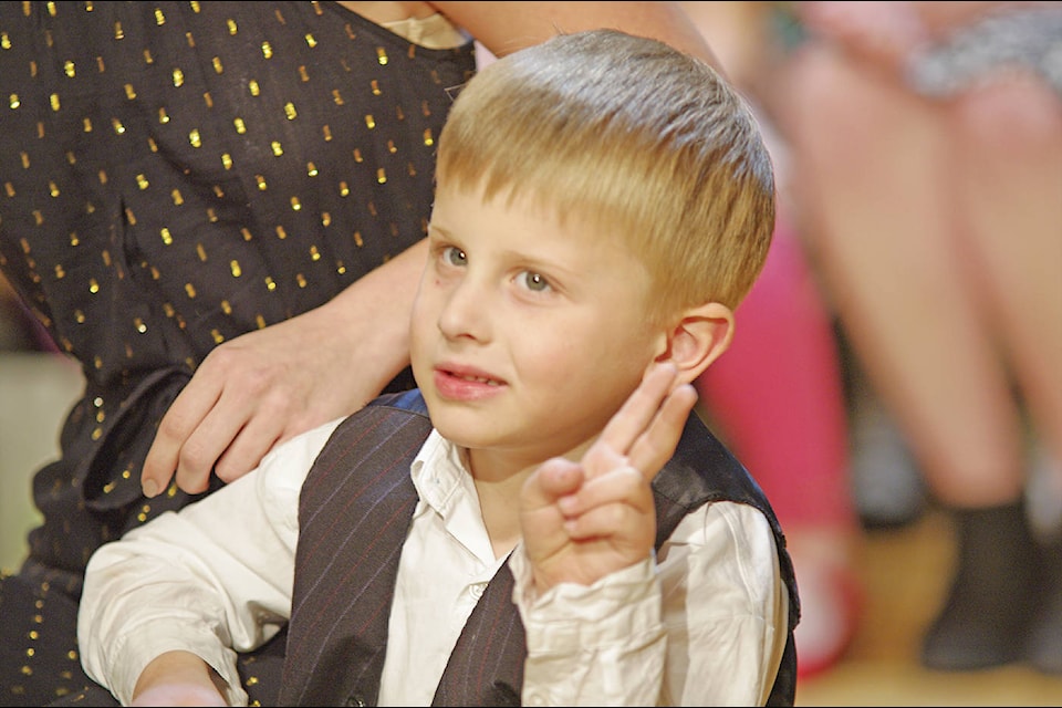 Nicholas Coulson from Deep Cove Elementary flashes a ‘V’ sign during the ceremony. (Steven Heywood/News Staff)