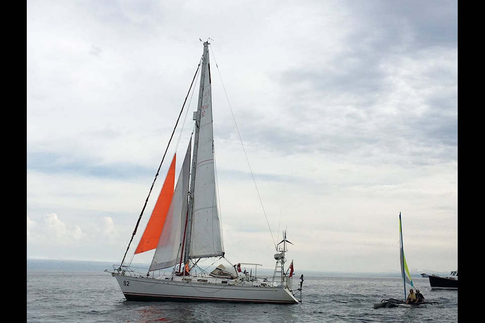 Jeanne Socrates’ sailboat stood out from the others that had come to join her with its orange sail. (Devon Bidal/News Staff)