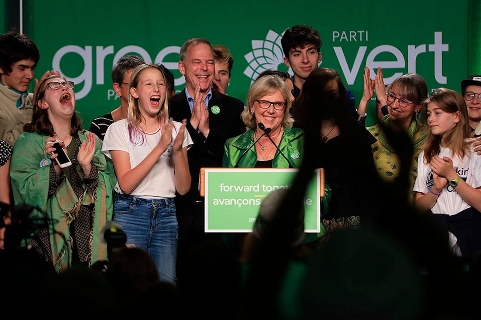 Green Party of Canada leader Elizabeth May celebrates her party winning three seats at the Green Party of Canada’s election night party at the Crystal Gardens in Victoria. (Arnold Lim/News Staff)