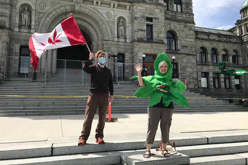 A small crowd shows solidarity for the Victoria Cannabis Buyers Club after a July 15 raid. (Kendra Crighton/Black Press)