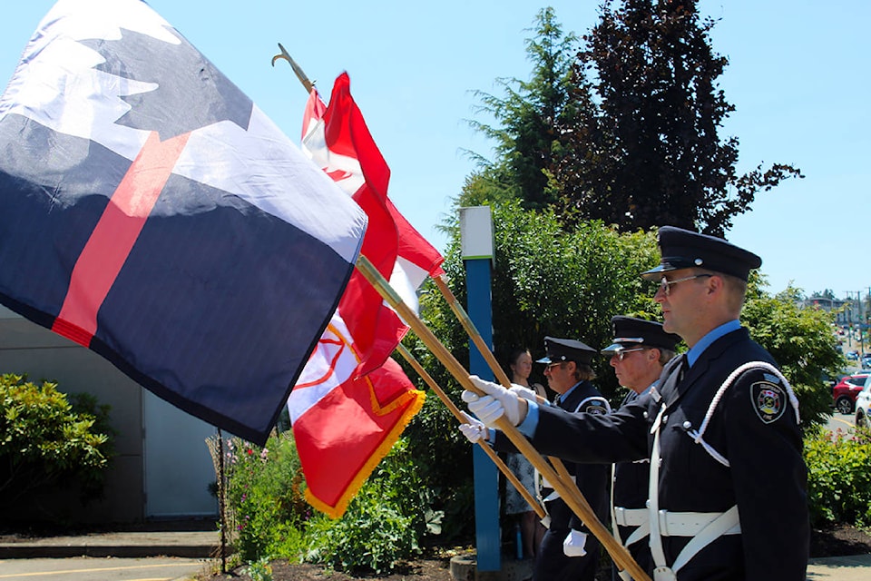 The parade begins with firefighters from across Greater Victoria and the province marching in John Cassidy’s honour. (Megan Atkins-Baker/News Staff)