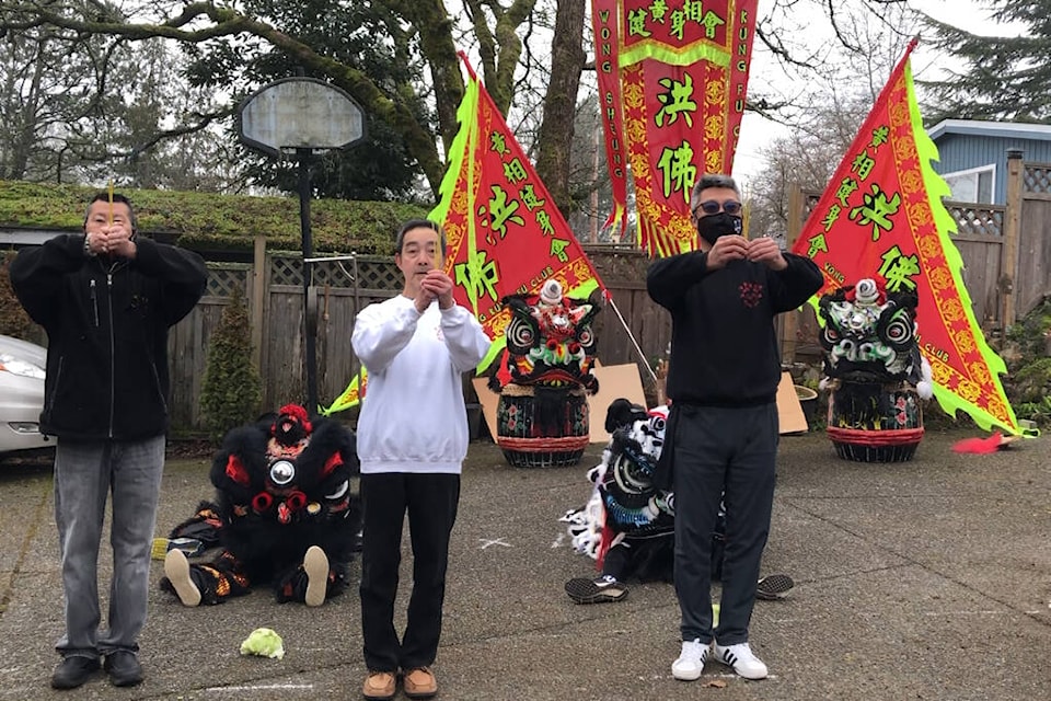 Terry Lee, left, Edmond Wong and Daniel Low of the Wong Sheung Kung Fu Club perform eye dotting ceremony as part of the virtual Chinese New Year celebration online Feb. 1. (Courtesy Wong Sheung Kung Fu Club)