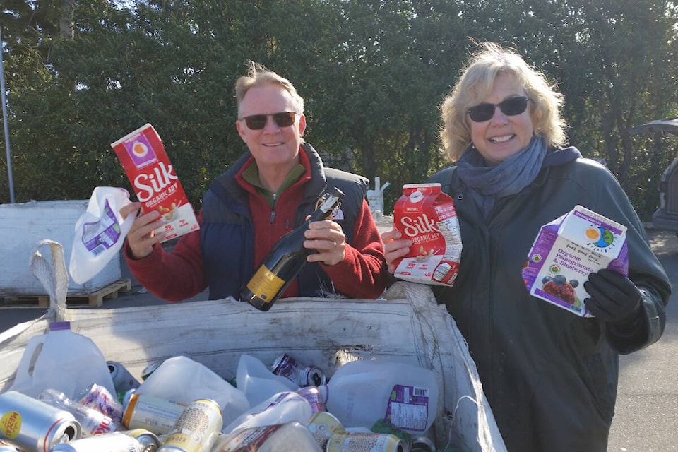 Oak Bay High is a hub of activity as students, alumni and Rotary gather for a bottle drive to repair the track behind the school. (Courtesy of Daphne Good)