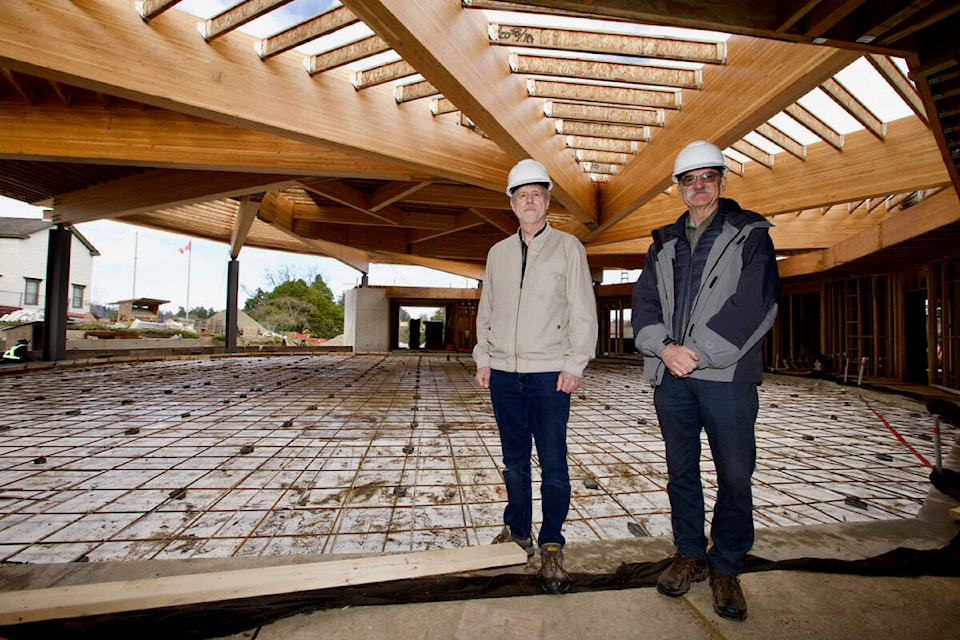 Jim Maxwell, president of the Victoria Highland Games Association and Ian Booth, president of the Victoria Scottish Community Centre Society stand inside the under-construction Craigflower Community and Performing Arts Centre on March 31. (Justin Samanski-Langille/News Staff)