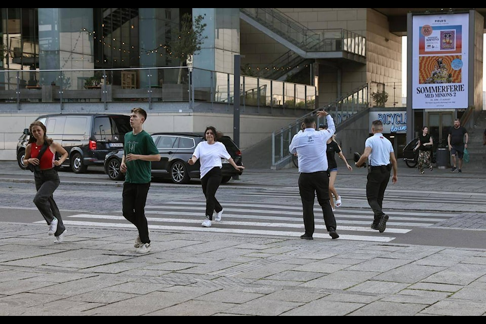 People evacuated from the Field’s shopping center run, in Orestad, Copenhagen, Denmark, Sunday, July 3, 2022, after reports of shots fired. (Olafur Steinar Gestsson /Ritzau Scanpix via AP)