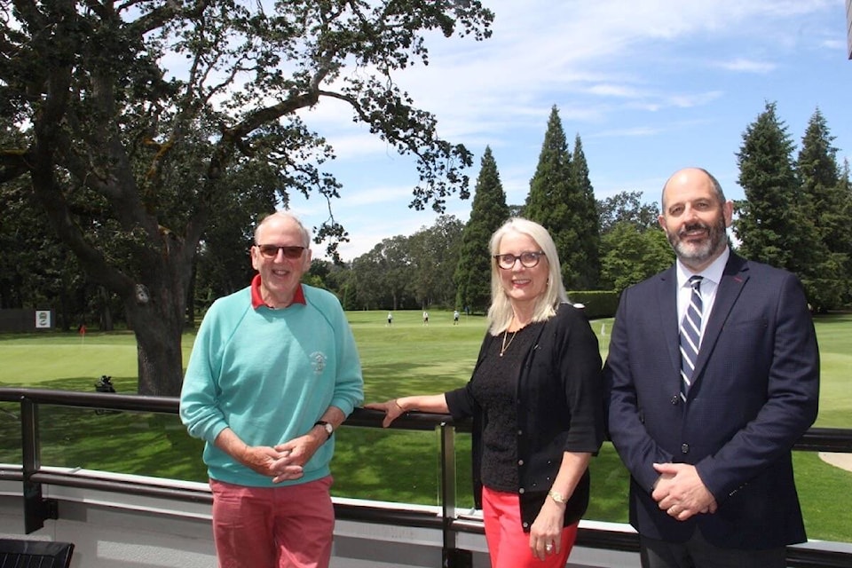 Member and author Frank Wilson with Jan Allen, membership, administration and web services and general manager Simon Gatrell showcase the view from above as Uplands Golf Club marks 100 years this summer. (Christine van Reeuwyk/News Staff)