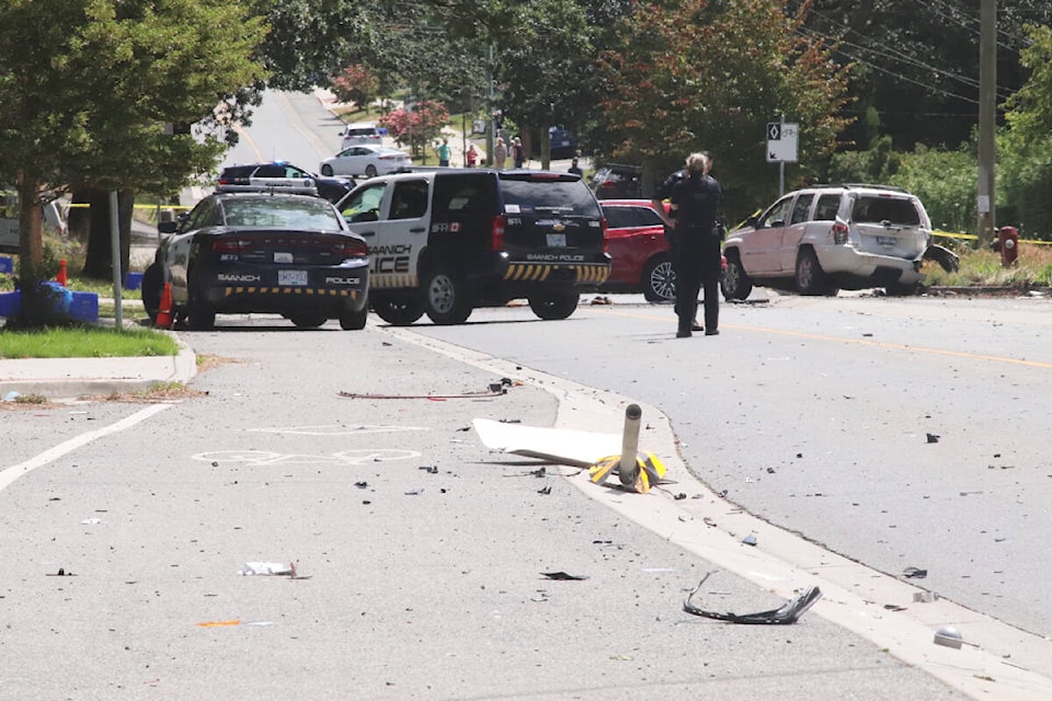 Debris is strewn along the 3300-block of Cook Street following a high-speed vehicle incident involving one driver and multiple parked cars. (Don Descoteau/News Staff)