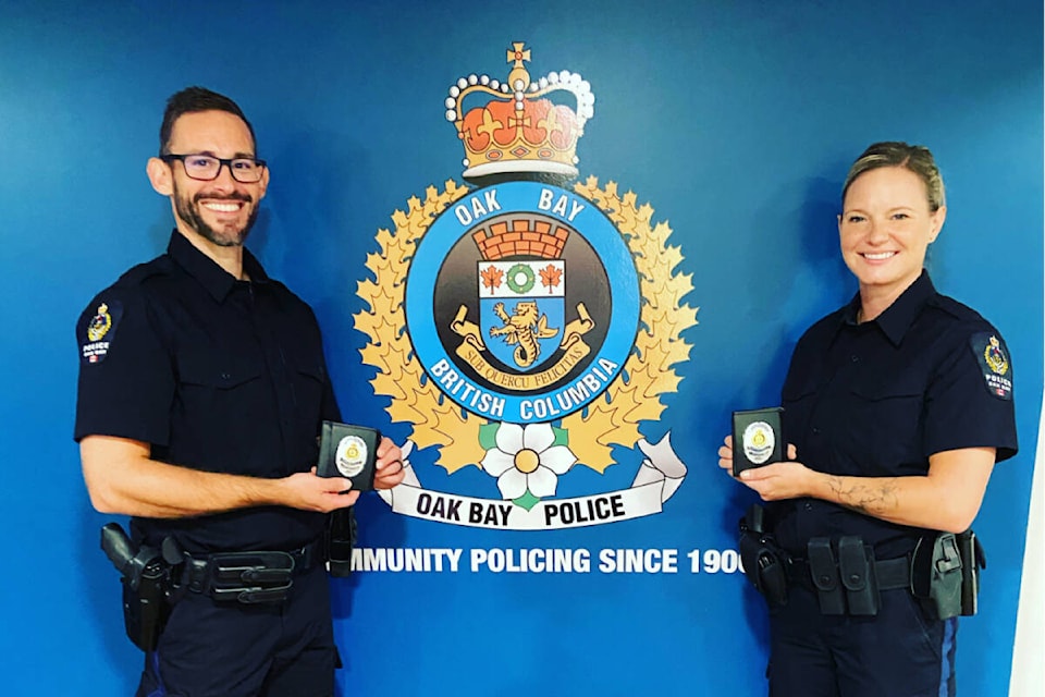 Const. Adam Goard, left, and Const. Cheryl Goard are sworn in August 2022. (Courtesy Oak Bay Police Department)