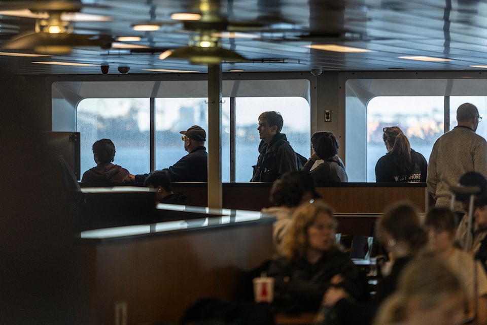 Passengers line up to buy food aboard a BC Ferries sailing from Tsawwassen to Swartz Bay.
