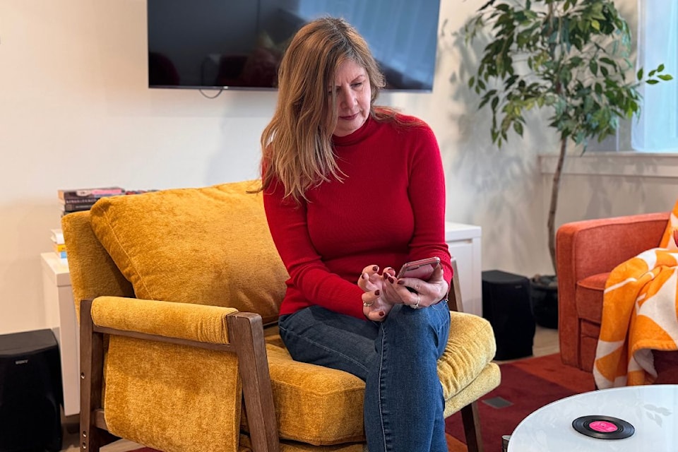 Jana Zachariou starts her day by checking on her short-term rental notifications.