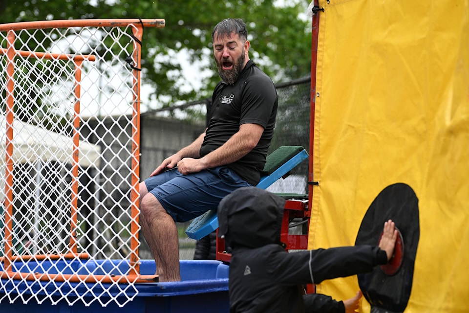 Penticton Chamber of Commerce president Michael Magnusson takes a dive at the Discovery House Father's Day fundraiser on June 16.