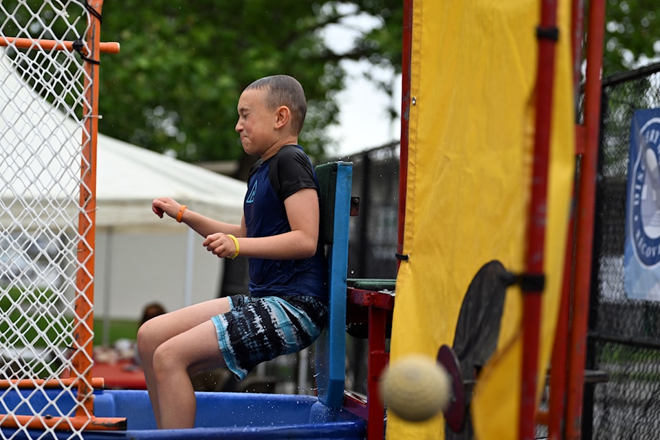 Leif, son of Discovery House's late former executive director Jerome Abraham, gets dunked into the water to raise funds for the program. 