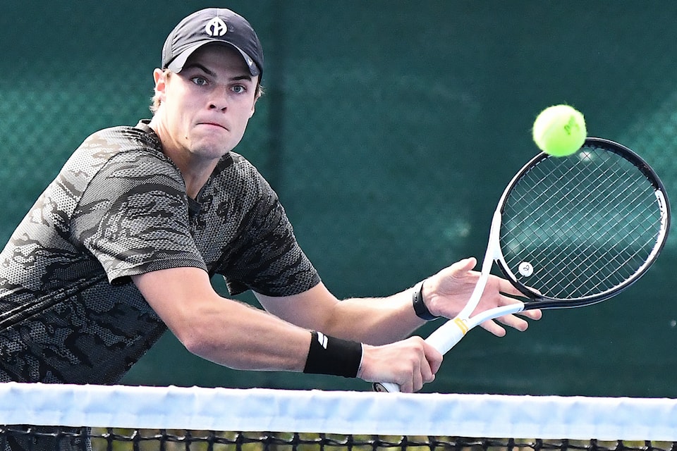 Former Summerland resident Spencer McIntosh now living in  hits this volley for a winner during action in the Birks Cup men's doubles event at the Penticton Tennis Club on the weekend.