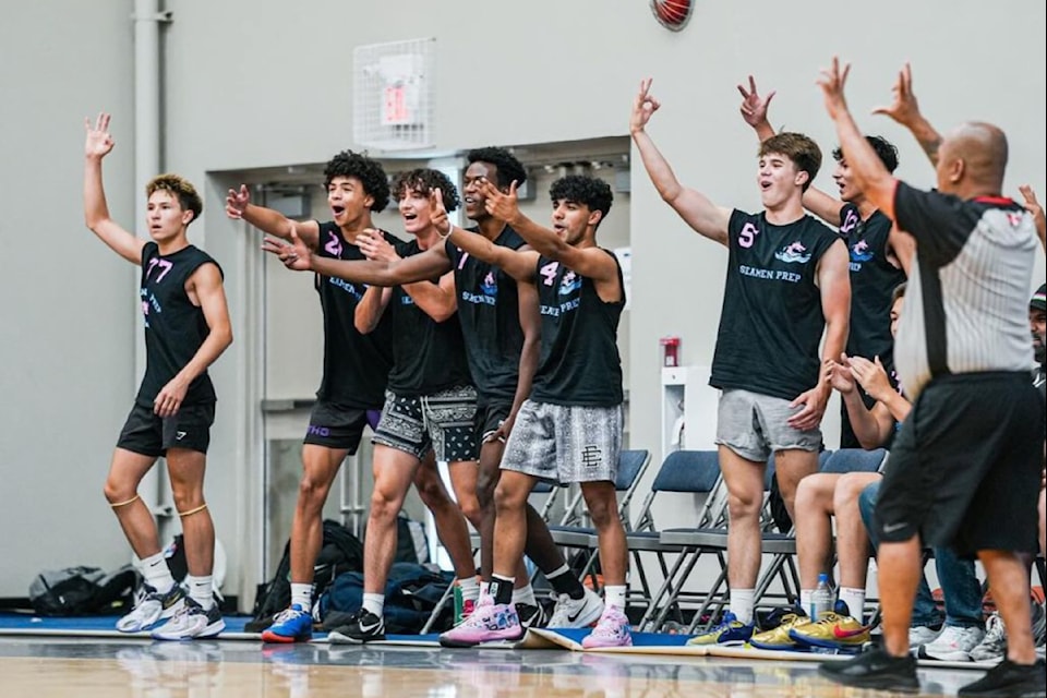 Members of SM Prep's U18 team, originally founded in Penticton, react to one of their teammates connecting on a three-point attempt.