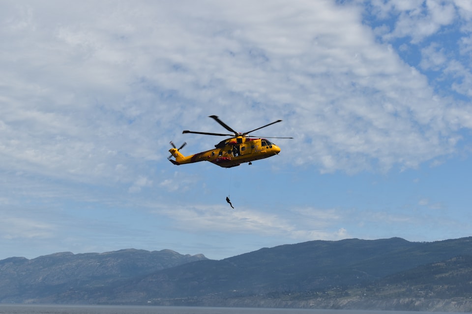 The Canadian Armed Forces' 442 Squadron Cormorant helicopter executing a live search and rescue demonstration above Okanagan Lake in Penticton on May 31, 2025.