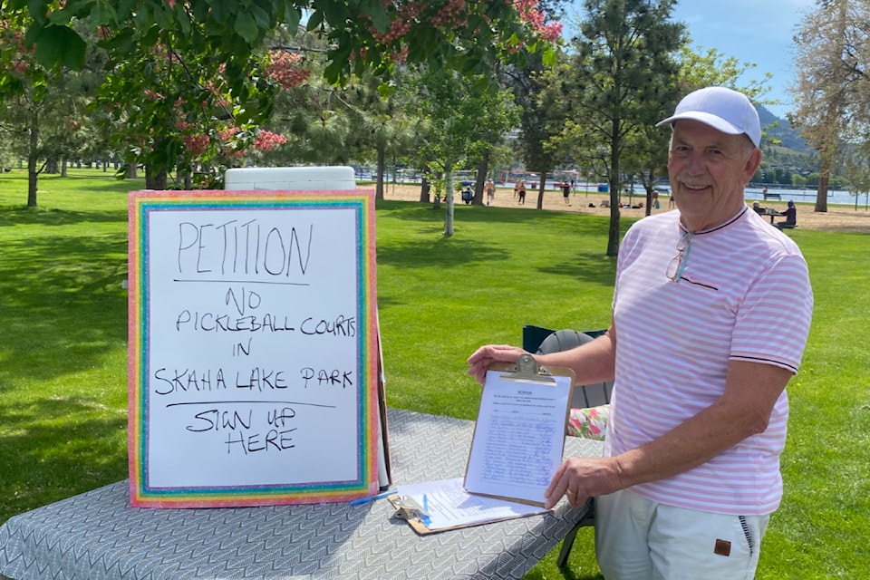 John Archer holds his petition in opposition to planned pickleball courts at Skaha Lake Park in May 2025. Archer says he resigned as chair of the city's parks and recreation committee to "fight" for his concerns over the courts.