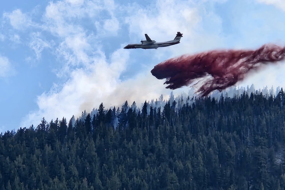 A BC Wildfire Service air tanker drops on a fire west of Penticton near Apex Mountain on June 17. No structures are currently threatened by the fire. 