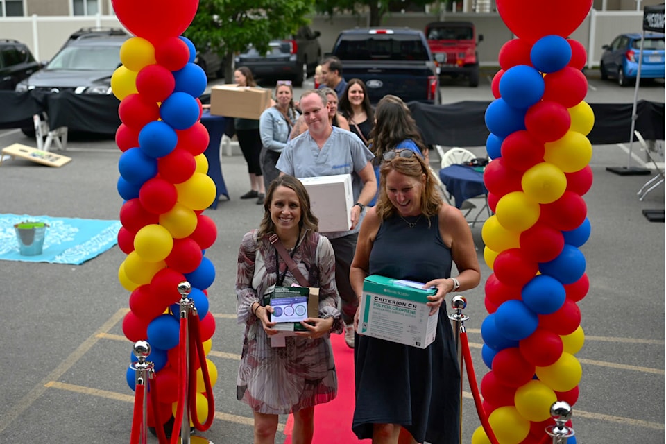 Kelly Hawes, executive director of the South Okanagan Similkameen Health Care Society, and Tracy St Claire, executive director of the South Okanagan Similkameen Division of Family Practice, lead the way for the move into the Colleen Schneider Medical Center on June 26.