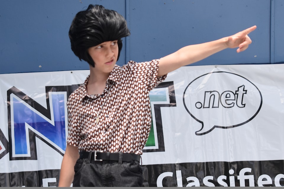11-year-old Elvis tribute artist Stage Ace points toward the audience at the 2025 Penticton Elvis Festival inside Gyro Park on June 28, 2025.
