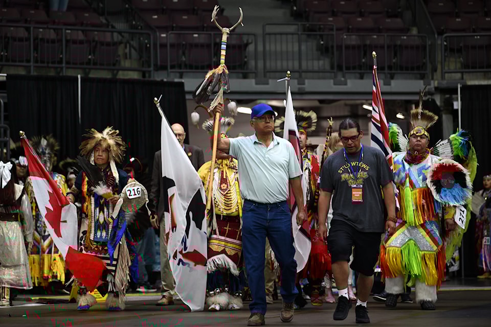 Penticton Indian Band Chief Greg Gabriel (centre) helps lead the first Grand Entry of the 2025 Pow Wow Between the Lakes at the South Okanagan Events Centre on July 19, 2025.