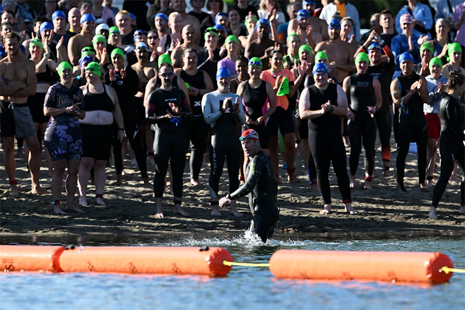 Vancouver's Peter Van Dyke looks back as he emerges first out of the water in the 2025 Peach Classic Triathlon on July 20. 
