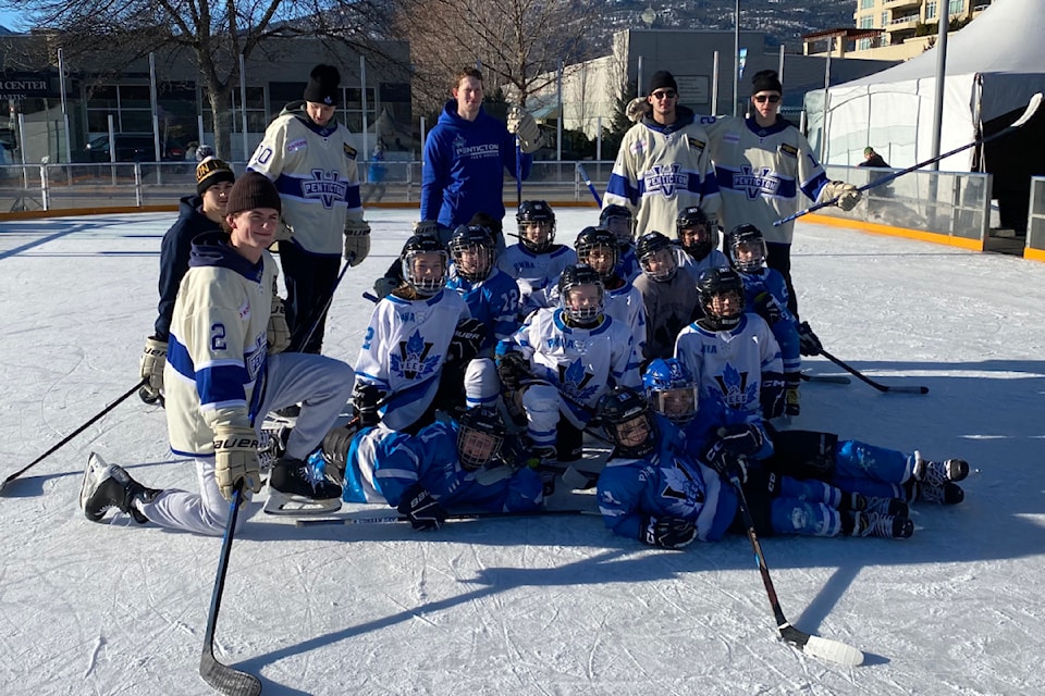 Members of the Penticton Vees and Penticton Minor Hockey Association after competing in a skills competition on Penticton's outdoor rink on Saturday, Jan. 18.