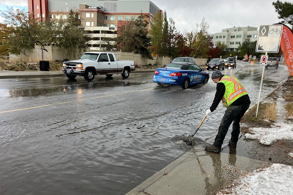 Crews conduct a road clean-up across from the Penticton Regional Hospital on Wednesday, Oct. 16, following a brief hail storm.