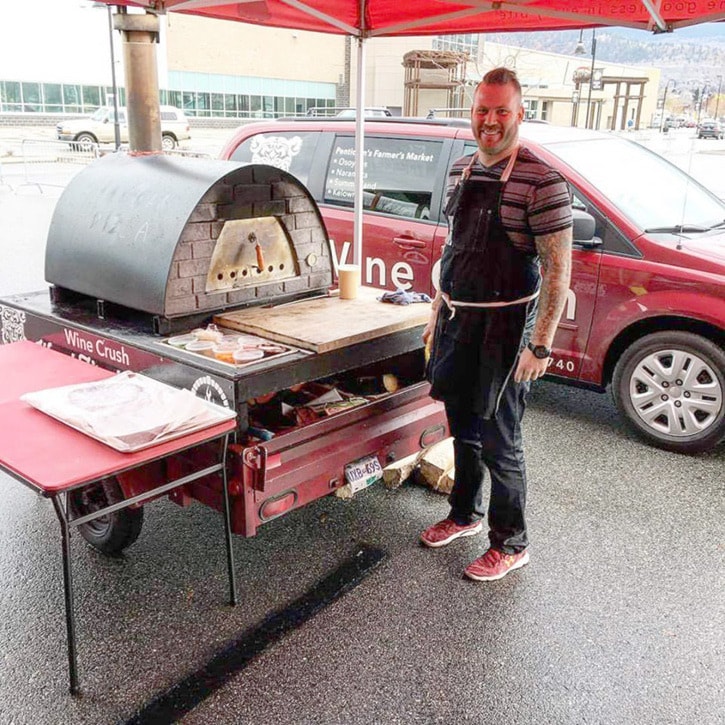 Wine Crush Market with their portable pizza oven.Courtsy of Wine Crush Market