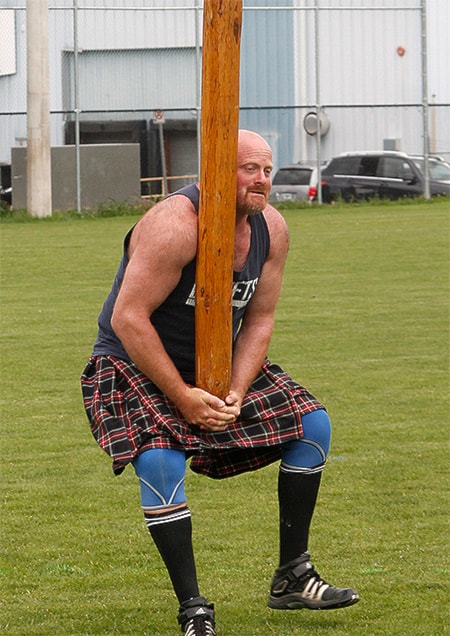 Lance Barusch perpares to toss a six-metre caber