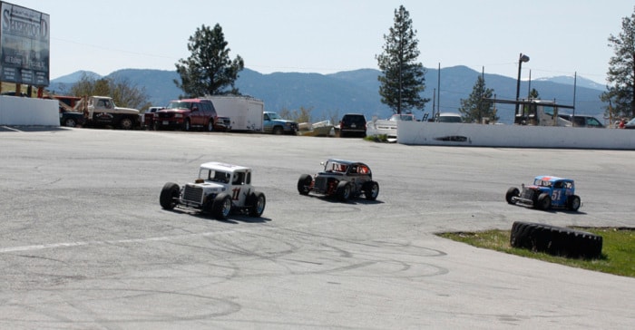 Dwarf cars warm up for Penticton Speedway's race day on Sunday.