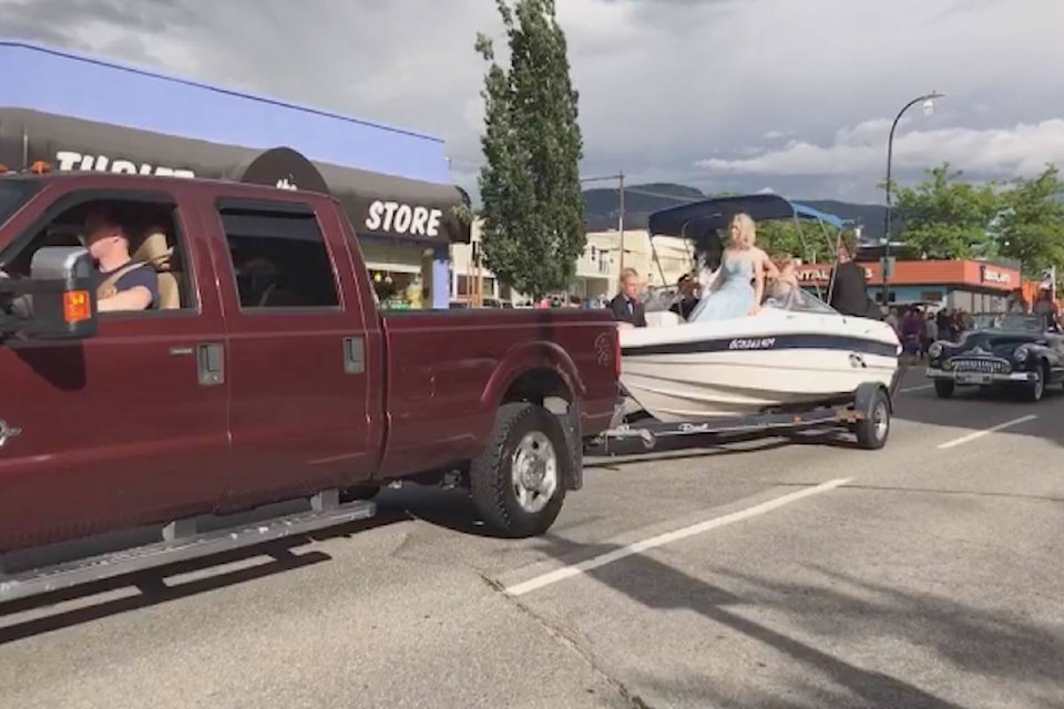 Pen High students rode in the backs of trucks, cars and even boats for their grad parade down Penticton’s Main Street on June 27. (Brennan Phillips - Western News)