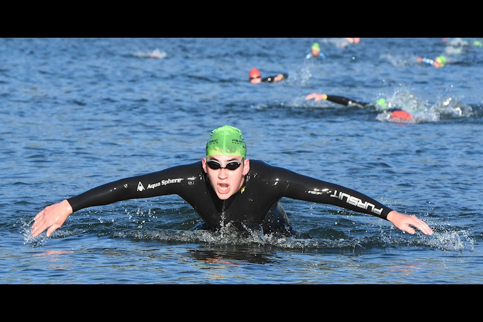 Holden Berrisford of Summerland is first out of the water in the sprint event and went on to place 18th overall and third in his age category in the annual Peach City Classic triathlon Sunday in Penticton. (Mark Brett - Western News)