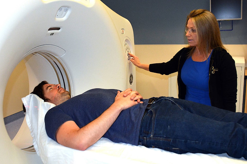 Karla Krook, a medical radiation technologist, prepares for a CT exam with Robert Hurford at Penticton Regional Hospital. The South Okanagan Similkameen Medical Foundation has launched a $3-million fundraising campaign to acquire a second CT scanner for PRH. (SOS Medical Foundation)