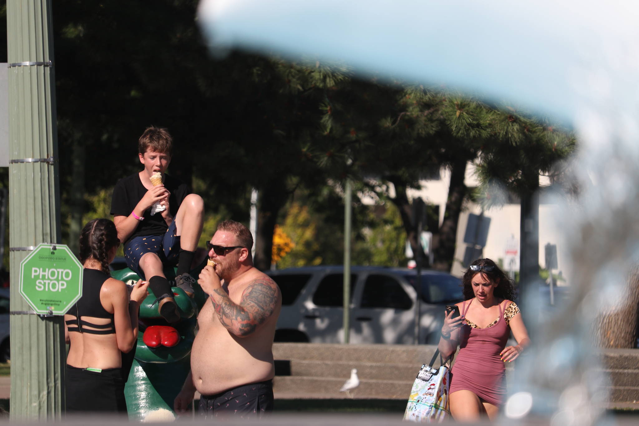 A family enjoys their ice cream in the heat in downtown Kelowna on Monday, July 27. (Aaron Hemens - Capital News)