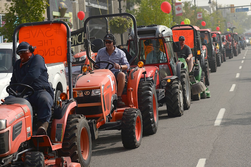 More than 20 farmers drove their tractors down Penticton’s Main Street today (Sept. 15), rallying against a proposed development in the Naramata Bench area. (Phil McLachlan - Western News)