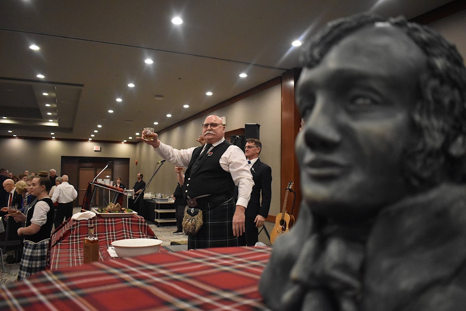 Bob McMillan raises a toast to Robbie Burns at the celebration for the 261st birthday of the Scottish Bard on Saturday, Jan. 18. (Brennan Phillips - Western News)