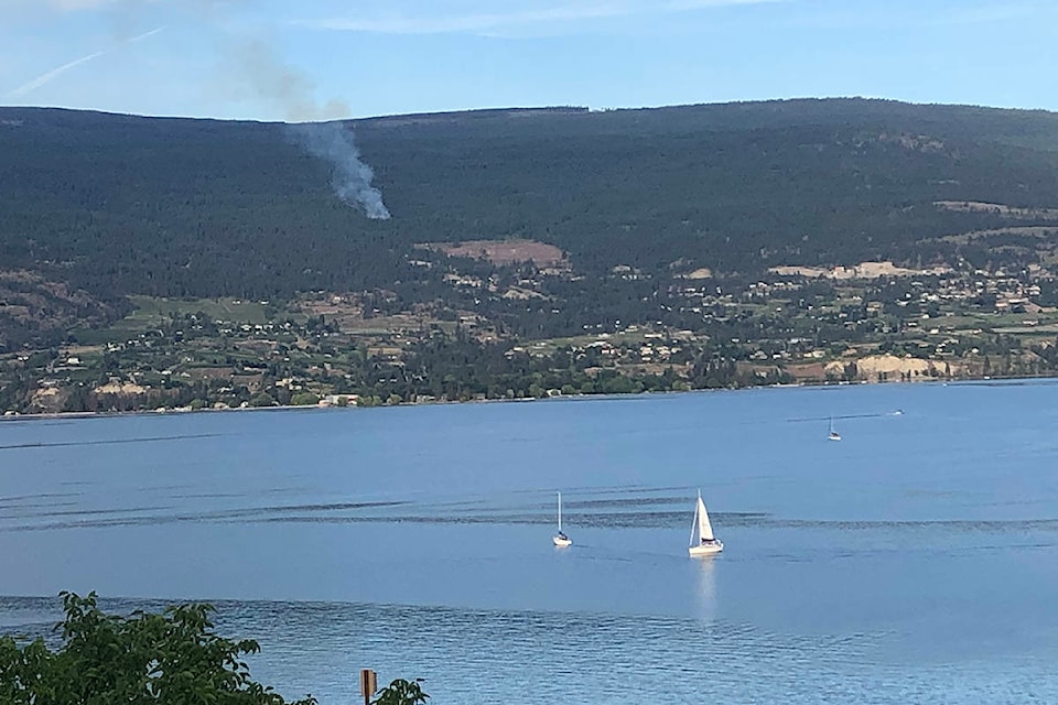 This photo of the small wildfire burning above Naramata was taken at 8 p.m. on Thursday, June 17, 2021 (Monique Tamminga Western News)