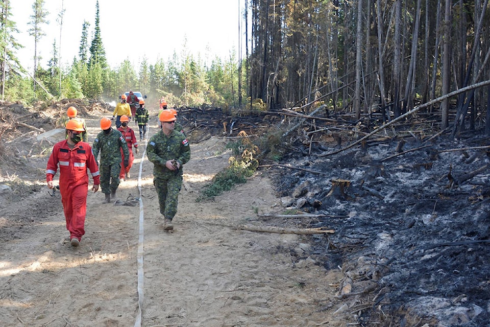 Canadian Armed Forces with BC Wildfire assessing damage at Thomas Creek fire Aug. 19, 2021. (BC Wildfire)