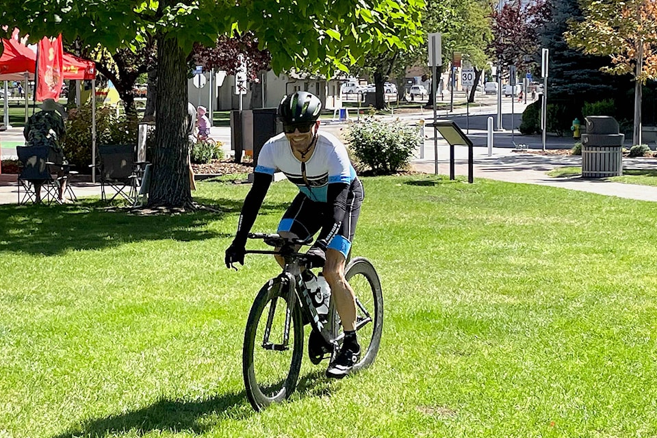 Penticton’s own champion triathlete Dave Matheson finishes the cycling portion of the Ironman course on Saturday, Aug. 28. (Brennan Phillips - Western News)