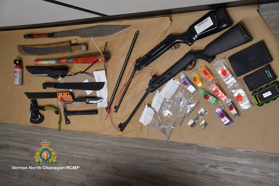 Vernon North Okanagan RCMP seized weapons, cash and drugs from four homes in the 3000 block of 24th Avenue Thursday, Dec. 2. (RCMP photo)