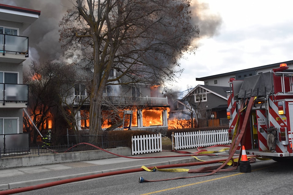 A heritage house at 434 Lakeshore Drive in Penticton engulfed in flames after a loud explosion was heard March 7, 2022. (Monique Tamminga Western News)