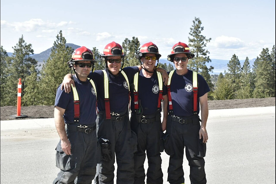 Members from the Kelowna Fire Department gearing up for wildfire training at Pineview Road and Evergreen Drive in Penticton. (Logan Lockhart, Western News)